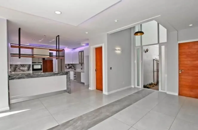 Completed open-plan home renovation with tiling and LED ceilings.